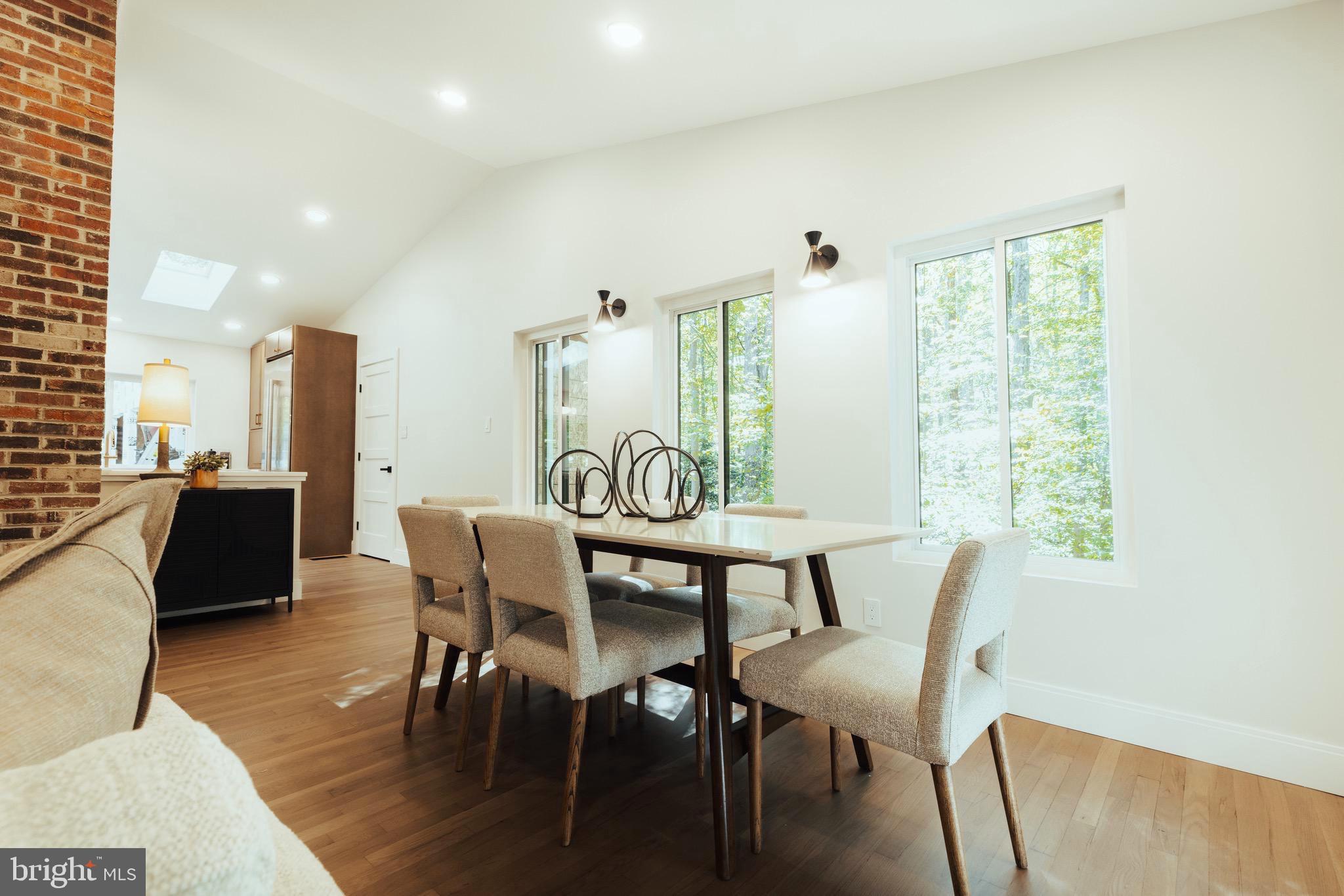 108 Interpromontory Road Great Falls, VA 22066 - Photo 8 of 108 a view of a dining room with furniture and wooden floor