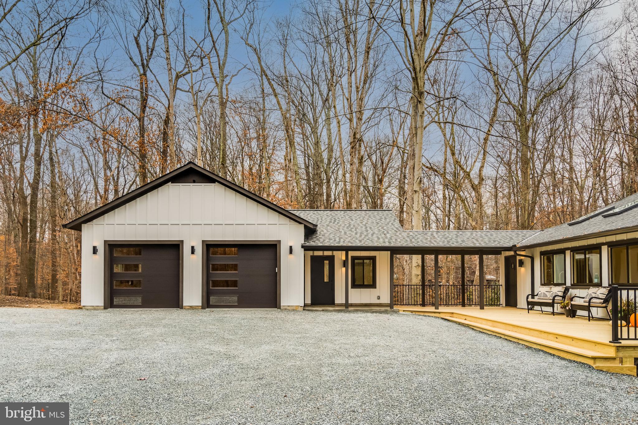 108 Interpromontory Road Great Falls, VA 22066 - Photo 81 of 93 a front view of a house with a yard and garage