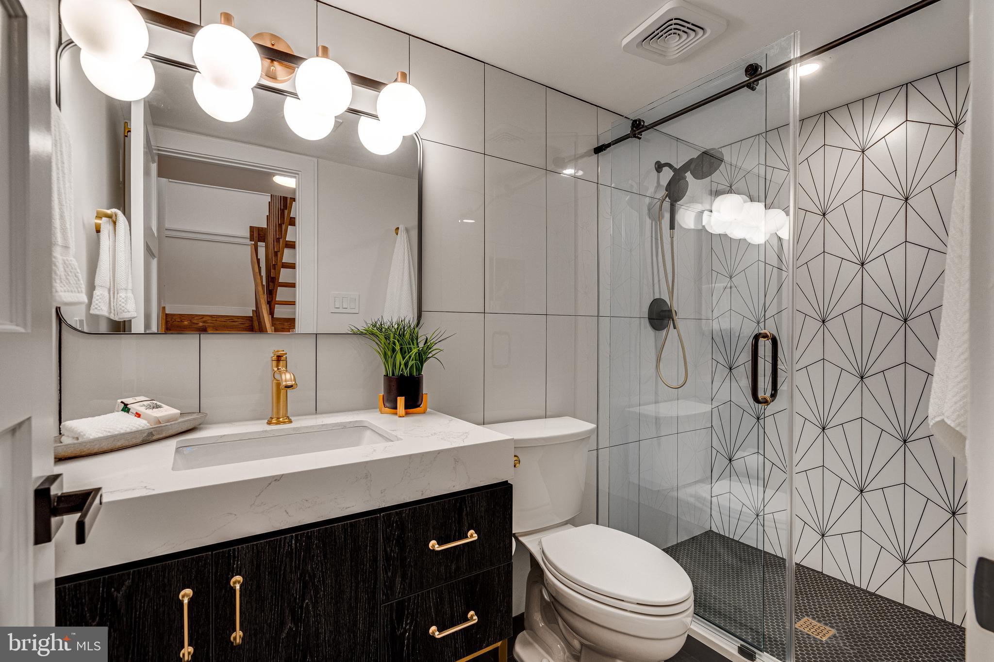 108 Interpromontory Road Great Falls, VA 22066 - Photo 84 of 108 a bathroom with a sink vanity mirror and toilet