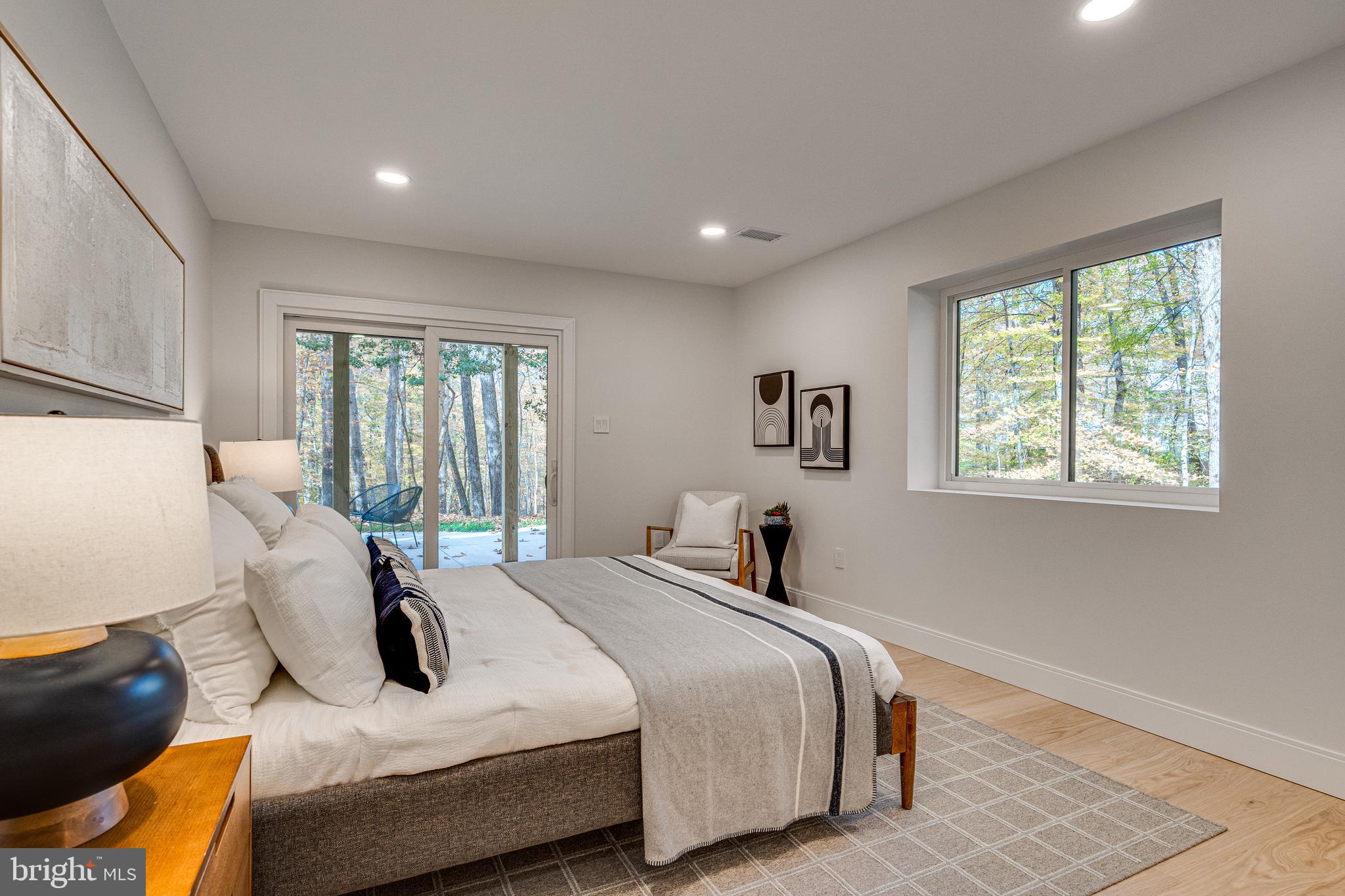 108 Interpromontory Road Great Falls, VA 22066 - Photo 89 of 108 a bedroom with a bed and glass window