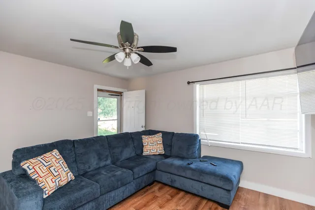 a living room with furniture and a window