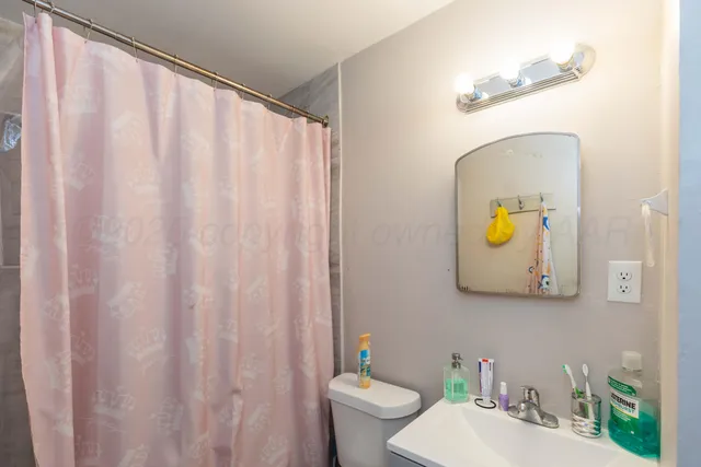 a bathroom with a toilet and a sink