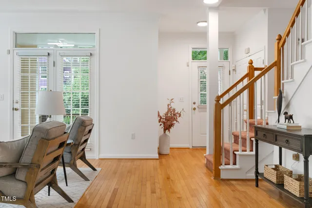 a view of entryway with wooden floor and stairs