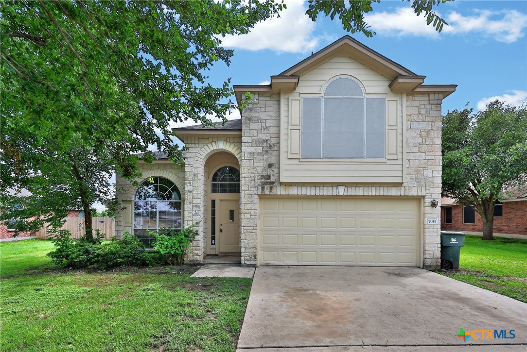 7015 Rickey Drive Temple, TX 76502 - Photo 4 of 29 a front view of a house with garden