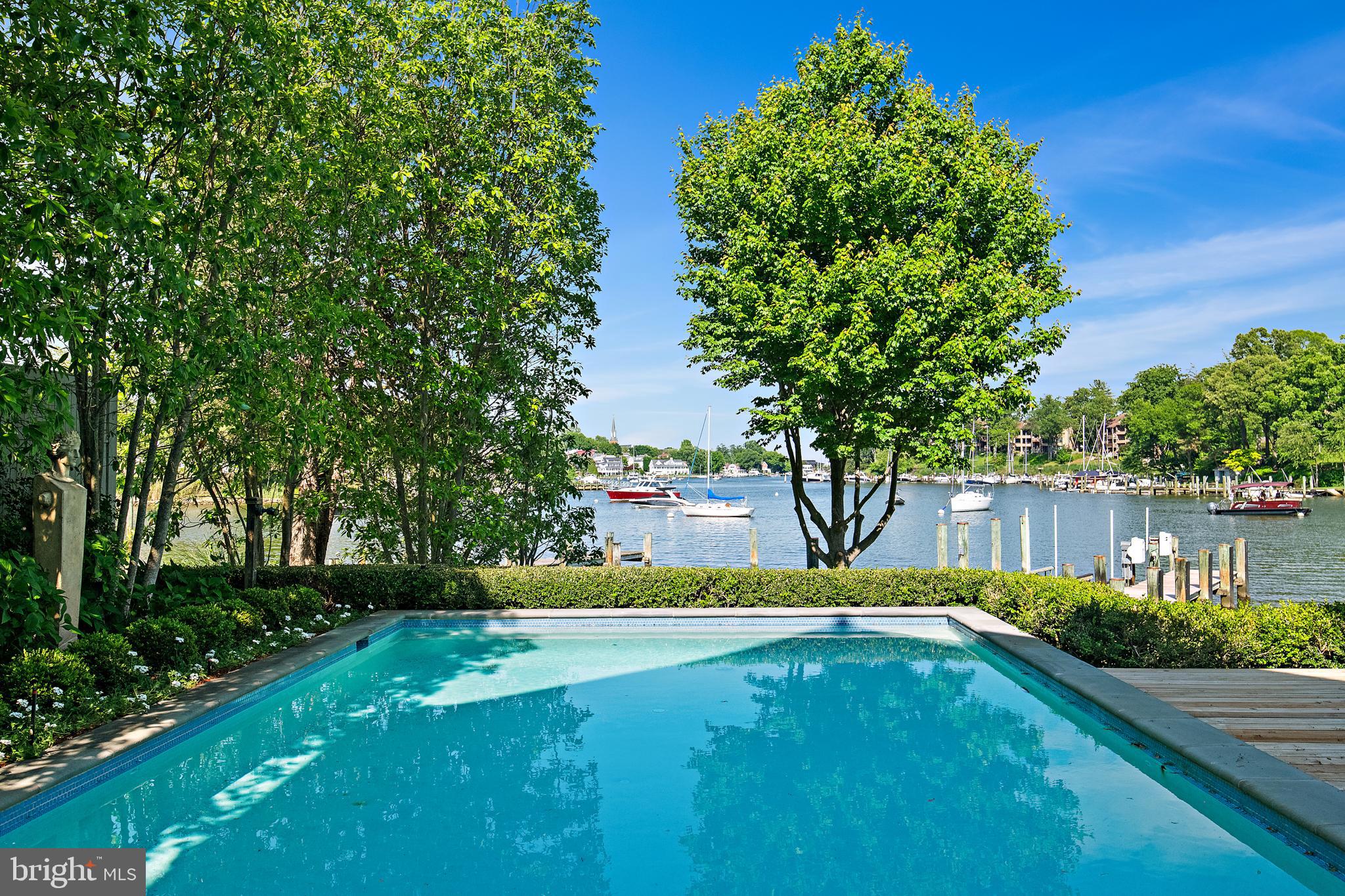 8 Spa View Circle Annapolis, MD 21401 - Photo 10 of 58 a view of a swimming pool with a garden
