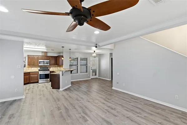 a view of kitchen and dining room with wooden floor