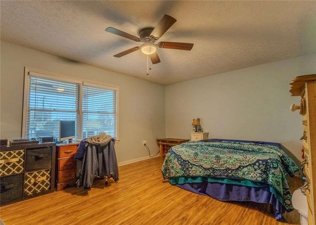 160 Highway 320 Carnesville, GA 30521 - Photo 20 of 68 a bedroom with a bed window and a table