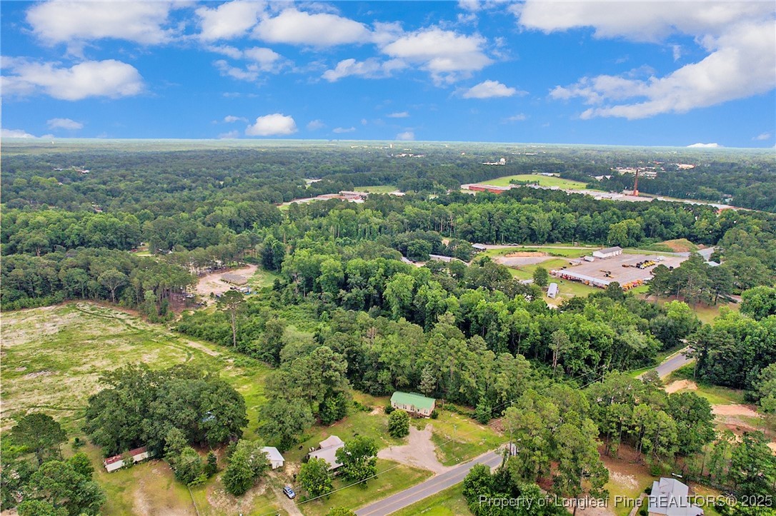 0 Mockingbird Hill Road Raeford, NC 28376 - Photo 4 of 14 an aerial view of residential houses with outdoor space and trees