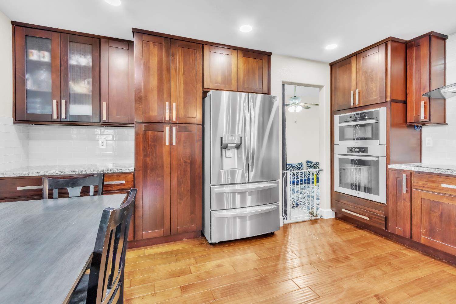 8148 Orchid Tree Way Antelope, CA 95843 - Photo 21 of 33 a kitchen with stainless steel appliances granite countertop a refrigerator and a stove top oven