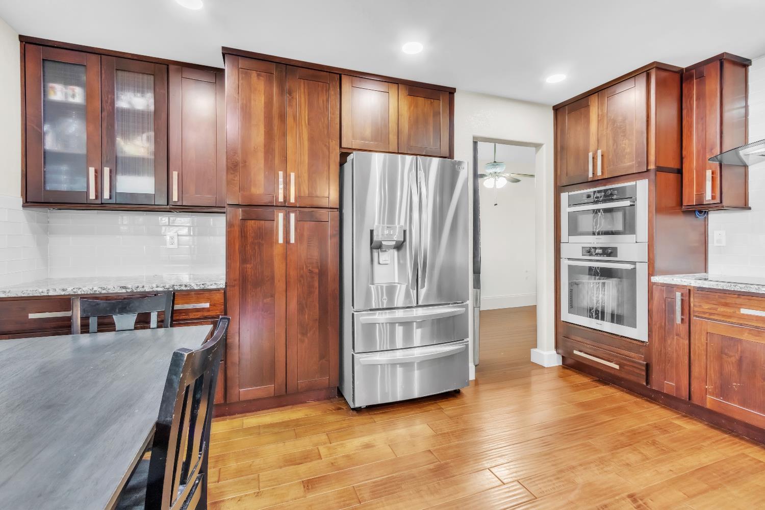8148 Orchid Tree Way Antelope, CA 95843 - Photo 22 of 33 a kitchen with stainless steel appliances granite countertop a refrigerator and a stove top oven