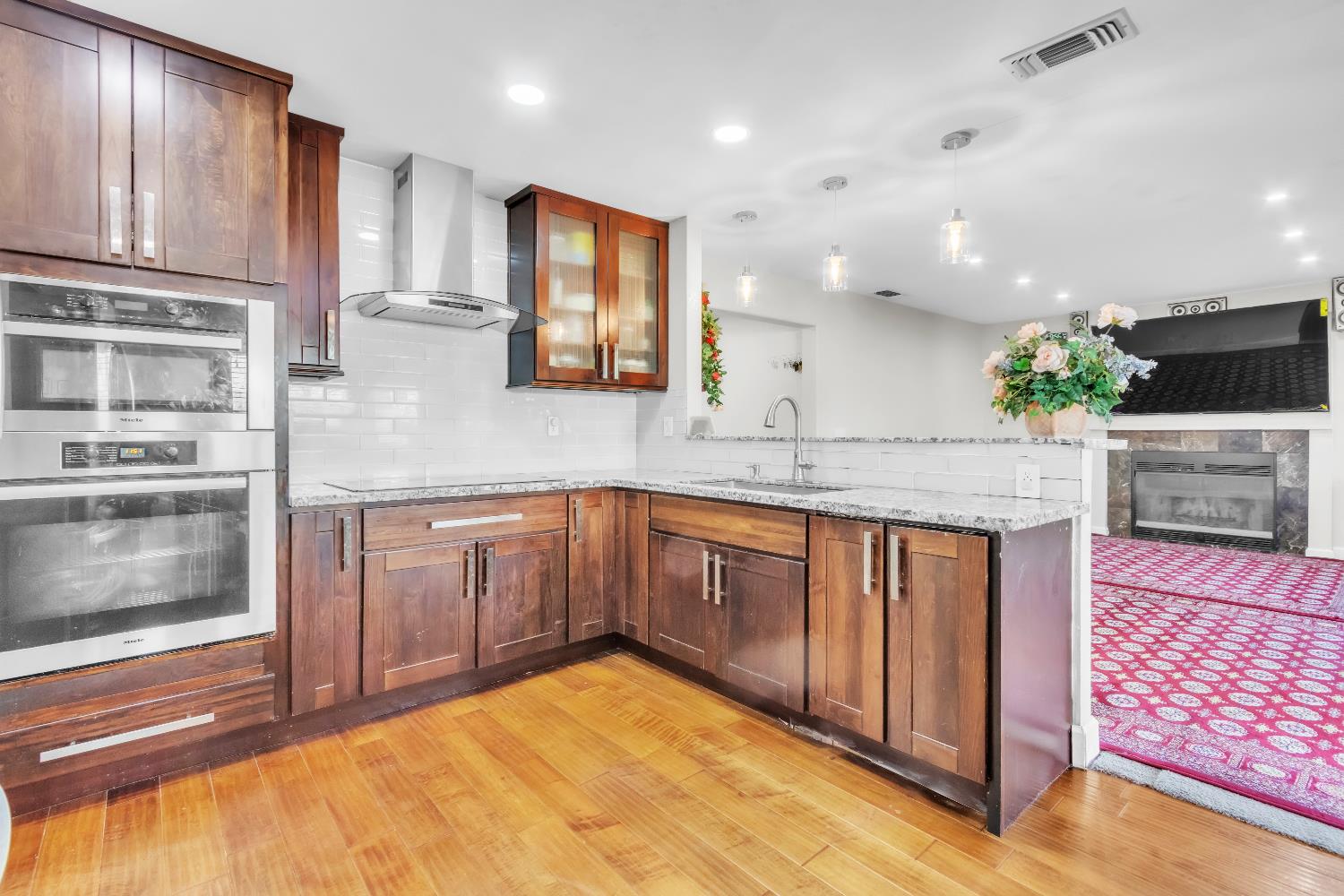 8148 Orchid Tree Way Antelope, CA 95843 - Photo 23 of 33 a kitchen with stainless steel appliances granite countertop a stove a sink and a microwave
