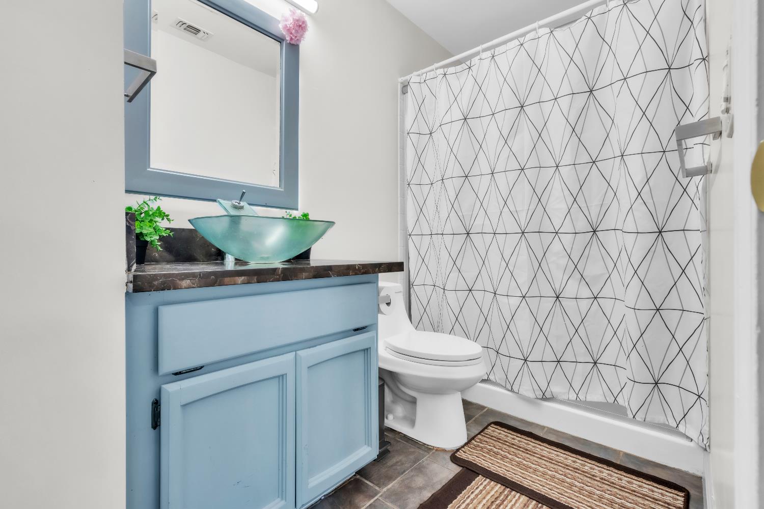 8148 Orchid Tree Way Antelope, CA 95843 - Photo 24 of 33 a bathroom with a toilet and a sink