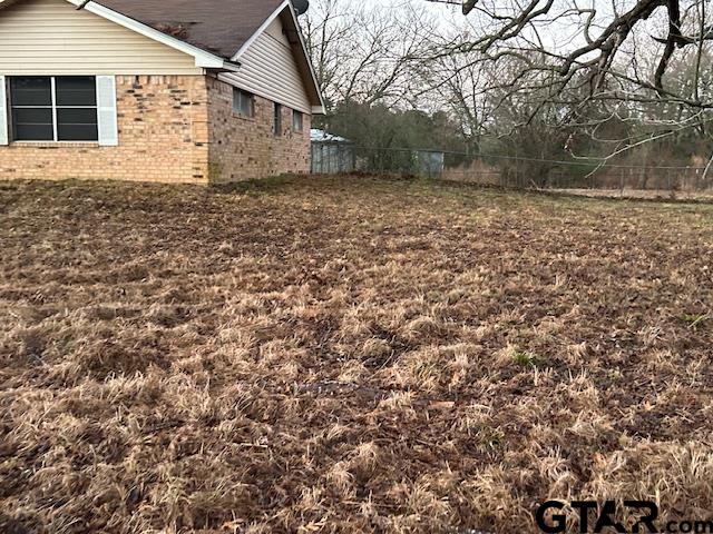 2707 Farm To Market Road 69 Quitman, TX 75783 - Photo 6 of 11 a backyard of a house with large trees