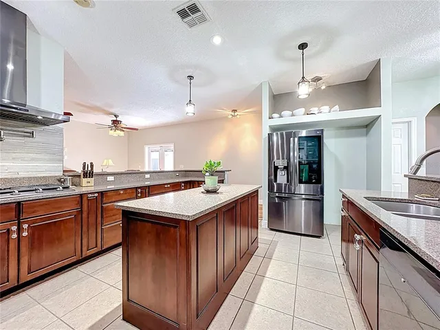 a kitchen with white cabinets and a sink