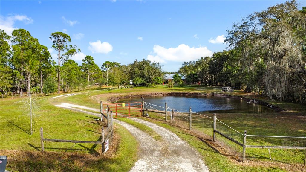 4295 Rambler Avenue St. Cloud, FL 34772 - Photo 2 of 54 a view of a swimming pool with a yard and seating area