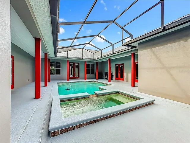 a backyard of a house with barbeque oven