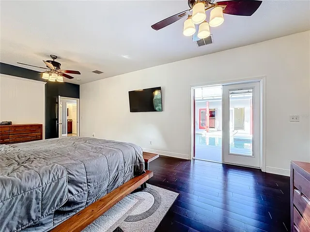 a bathroom with a granite countertop sink mirror and bathtub