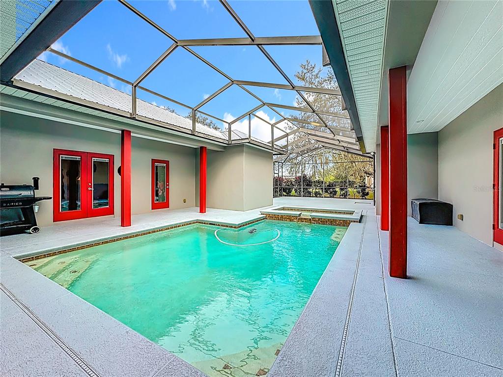 4295 Rambler Avenue St. Cloud, FL 34772 - Photo 40 of 54 a swimming pool with yard