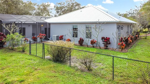 a view of a back yard of the house