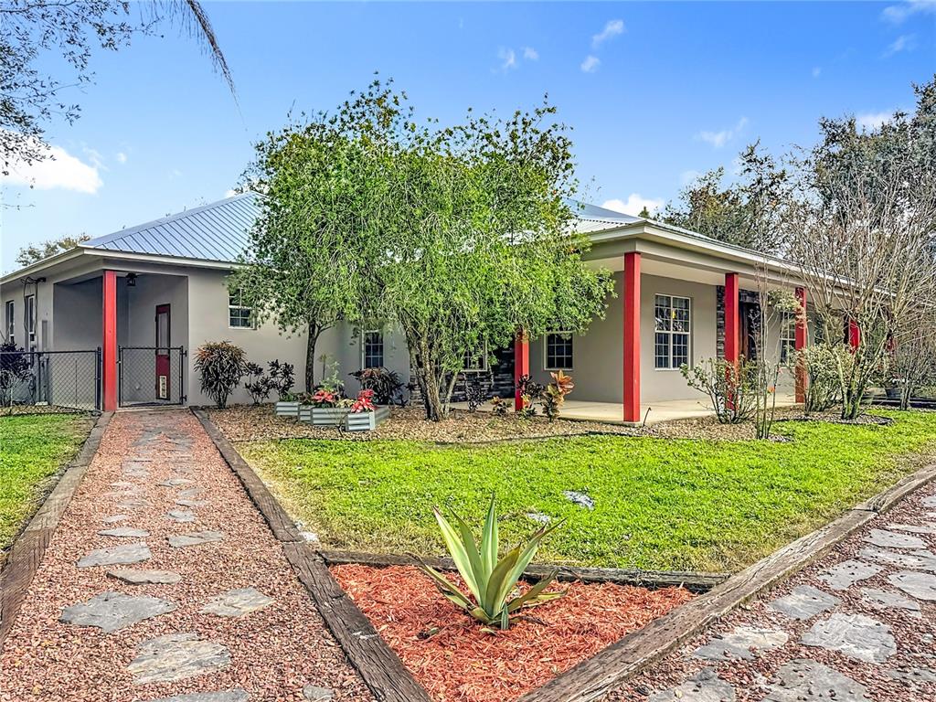 4295 Rambler Avenue St. Cloud, FL 34772 - Photo 6 of 54 a view of a house with backyard and sitting area