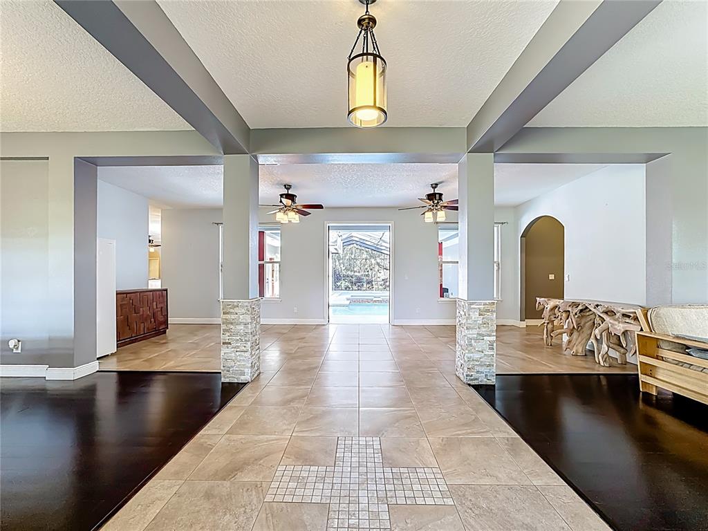 4295 Rambler Avenue St. Cloud, FL 34772 - Photo 9 of 54 a living room with couches and painting on the wall with wooden floor