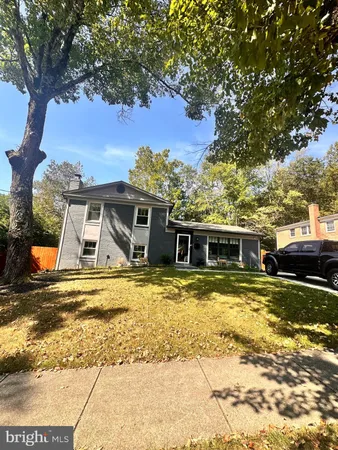 a view of a house with snow on the background