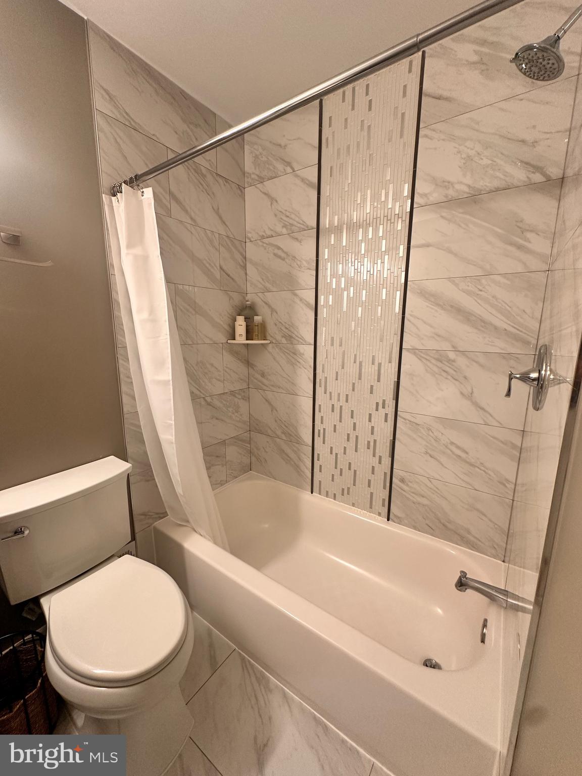 13304 Hathaway Drive Silver Spring, MD 20906 - Photo 17 of 59 a bathroom with a toilet and a bathtub