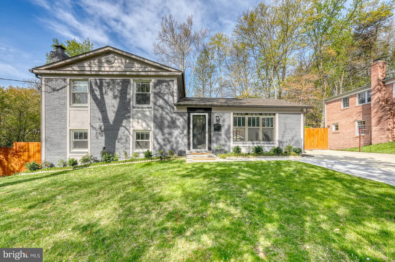 13304 Hathaway Drive Silver Spring, MD 20906 - Photo 2 of 59 a front view of a house with a garden