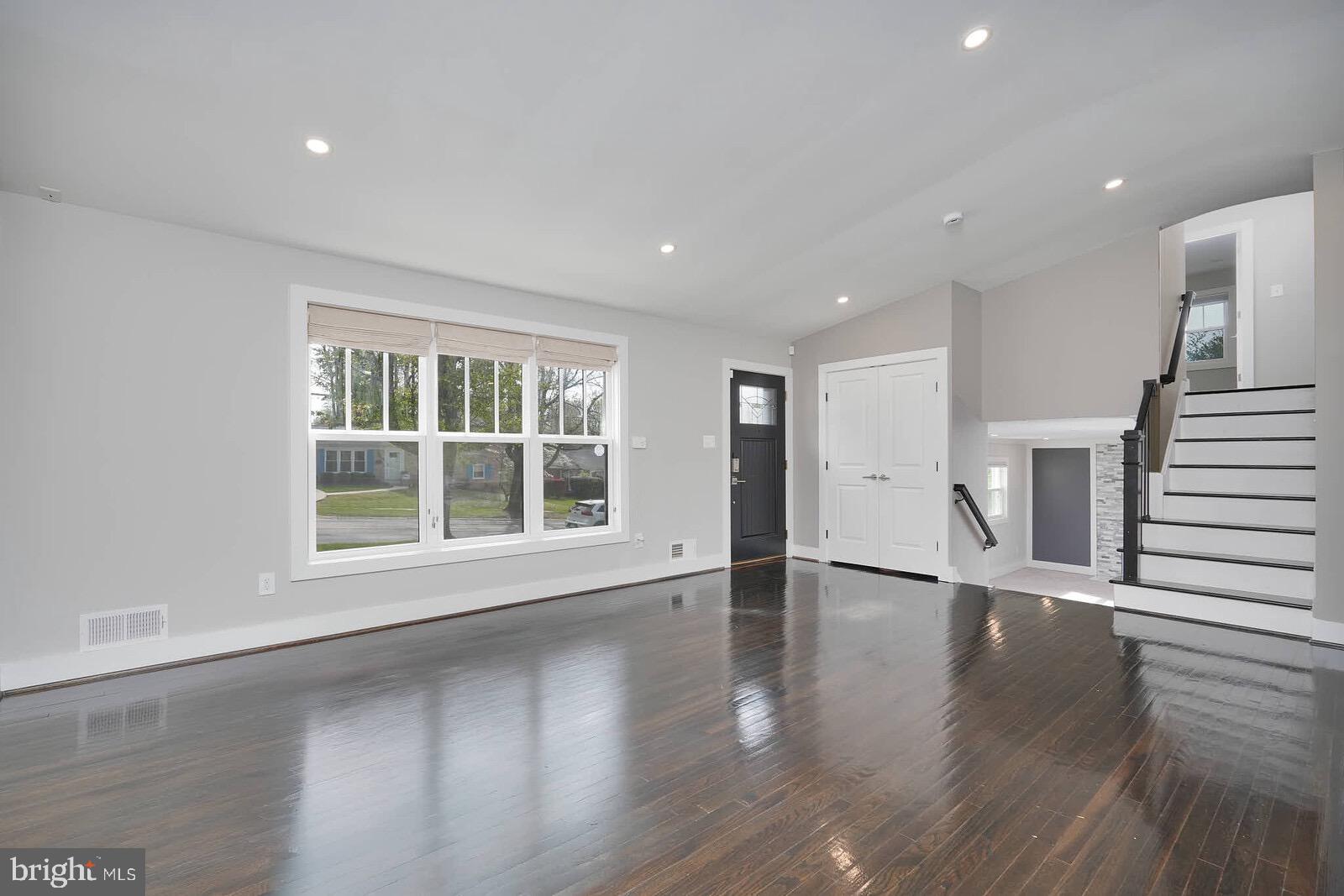 13304 Hathaway Drive Silver Spring, MD 20906 - Photo 28 of 59 a view of an empty room with wooden floor and a window