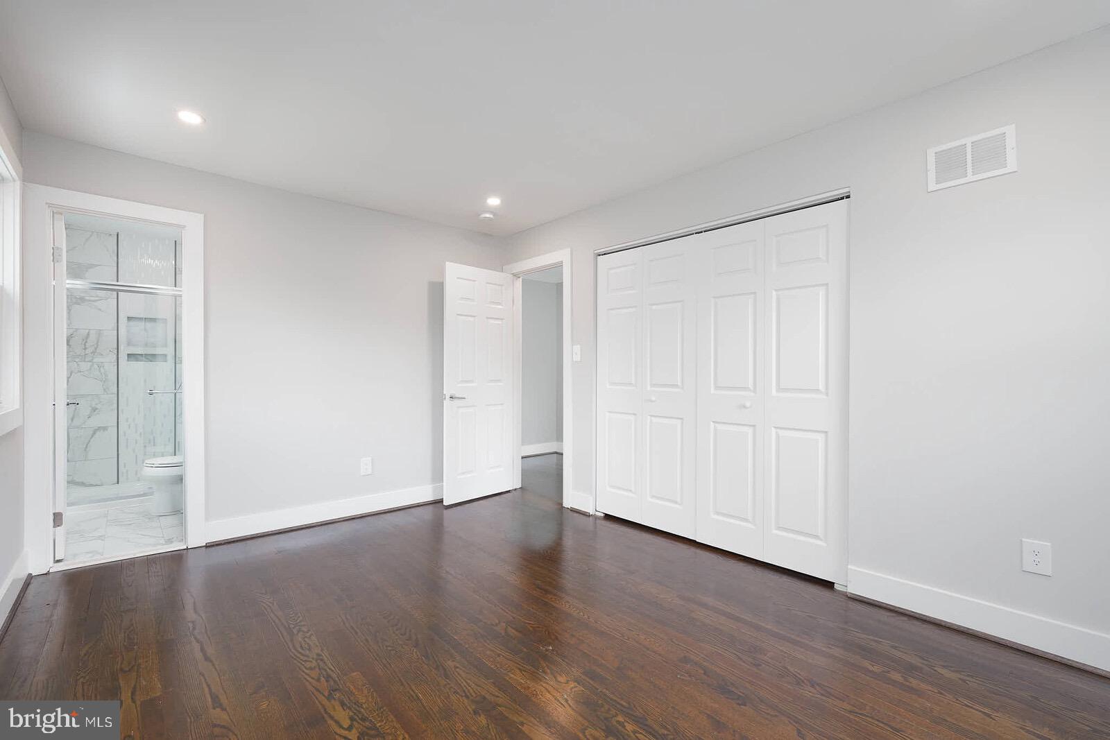13304 Hathaway Drive Silver Spring, MD 20906 - Photo 42 of 59 a view of an empty room with wooden floor and closet