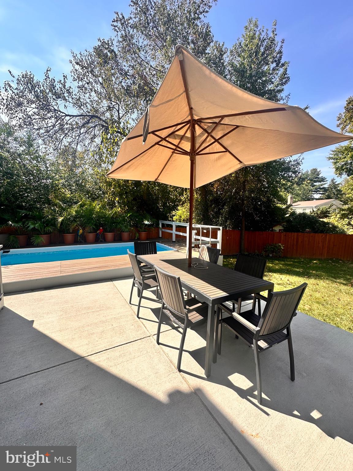 13304 Hathaway Drive Silver Spring, MD 20906 - Photo 43 of 59 a view of an outdoor sitting area with furniture and umbrella