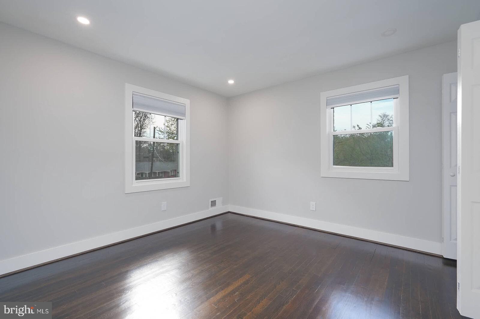 13304 Hathaway Drive Silver Spring, MD 20906 - Photo 46 of 59 a view of a room with wooden floor and windows