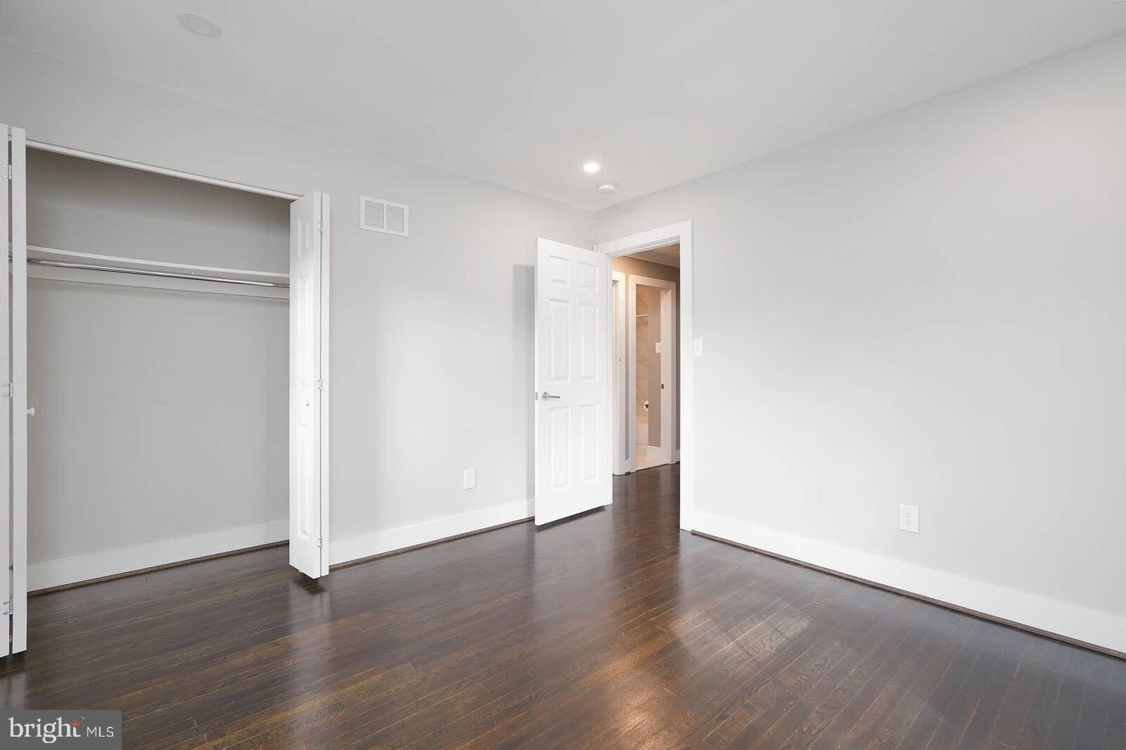 13304 Hathaway Drive Silver Spring, MD 20906 - Photo 47 of 59 a view of an empty room with wooden floor
