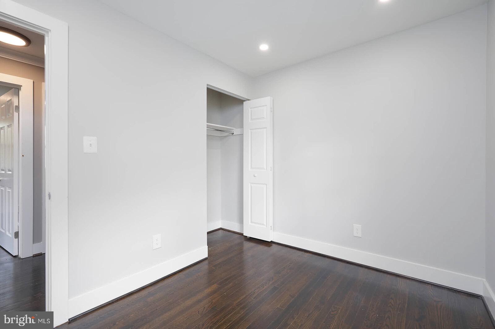 13304 Hathaway Drive Silver Spring, MD 20906 - Photo 49 of 59 an empty room with wooden floor