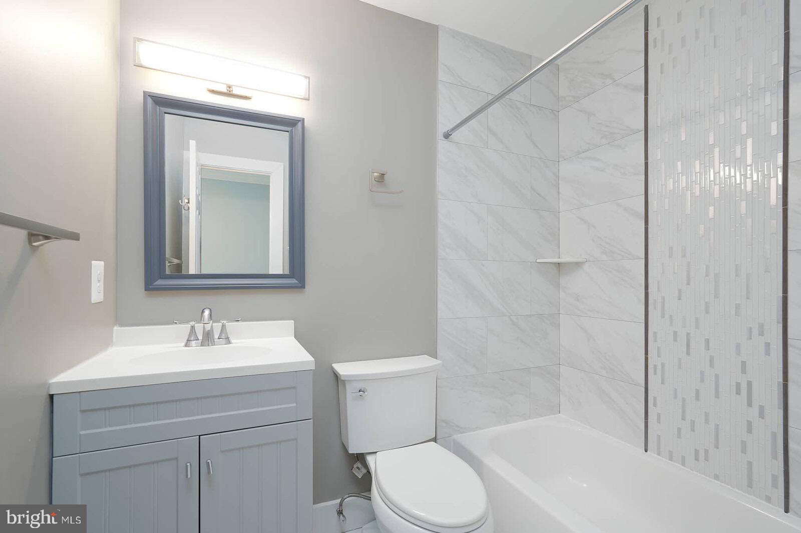 13304 Hathaway Drive Silver Spring, MD 20906 - Photo 50 of 59 a bathroom with a sink toilet and shower