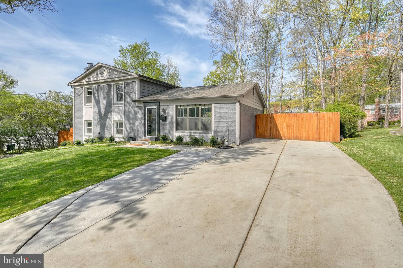 13304 Hathaway Drive Silver Spring, MD 20906 - Photo 5 of 59 a front view of house with yard and green space