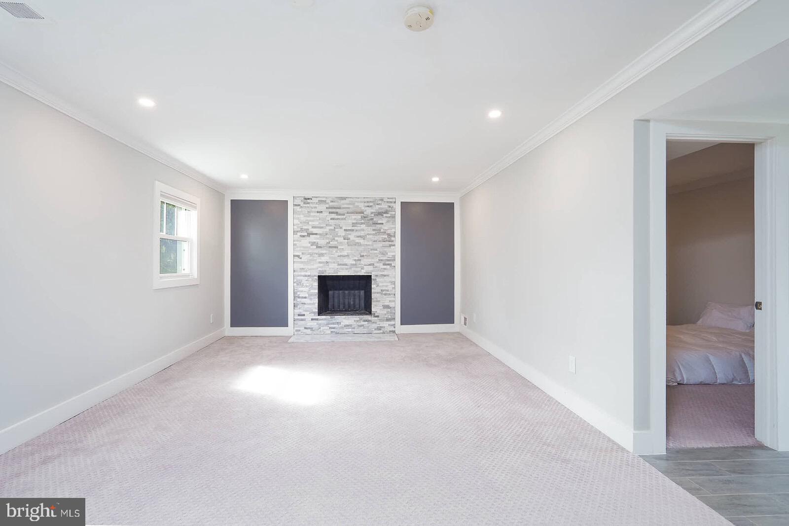 13304 Hathaway Drive Silver Spring, MD 20906 - Photo 52 of 59 an empty room with windows and fireplace