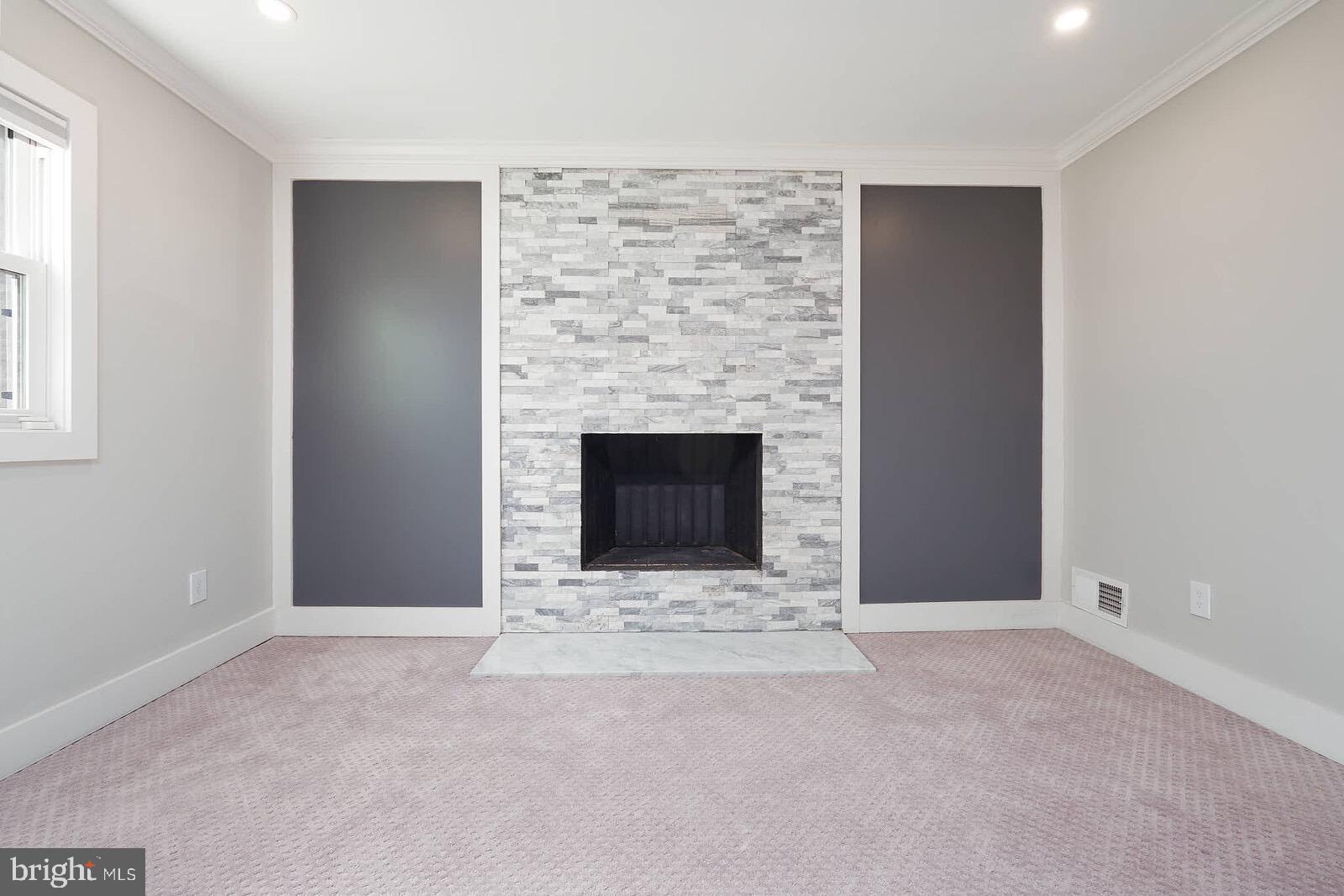 13304 Hathaway Drive Silver Spring, MD 20906 - Photo 53 of 59 a view of an empty room with a fireplace