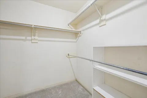 a view of an empty walk in closet