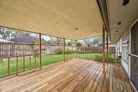 a view of balcony with wooden floor
