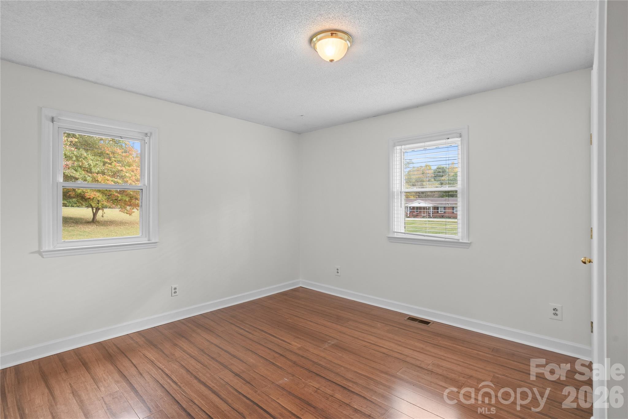 1335 Blacksnake Road Stanley, NC 28164 - Photo 25 of 31 a view of a room that has wooden floor and window