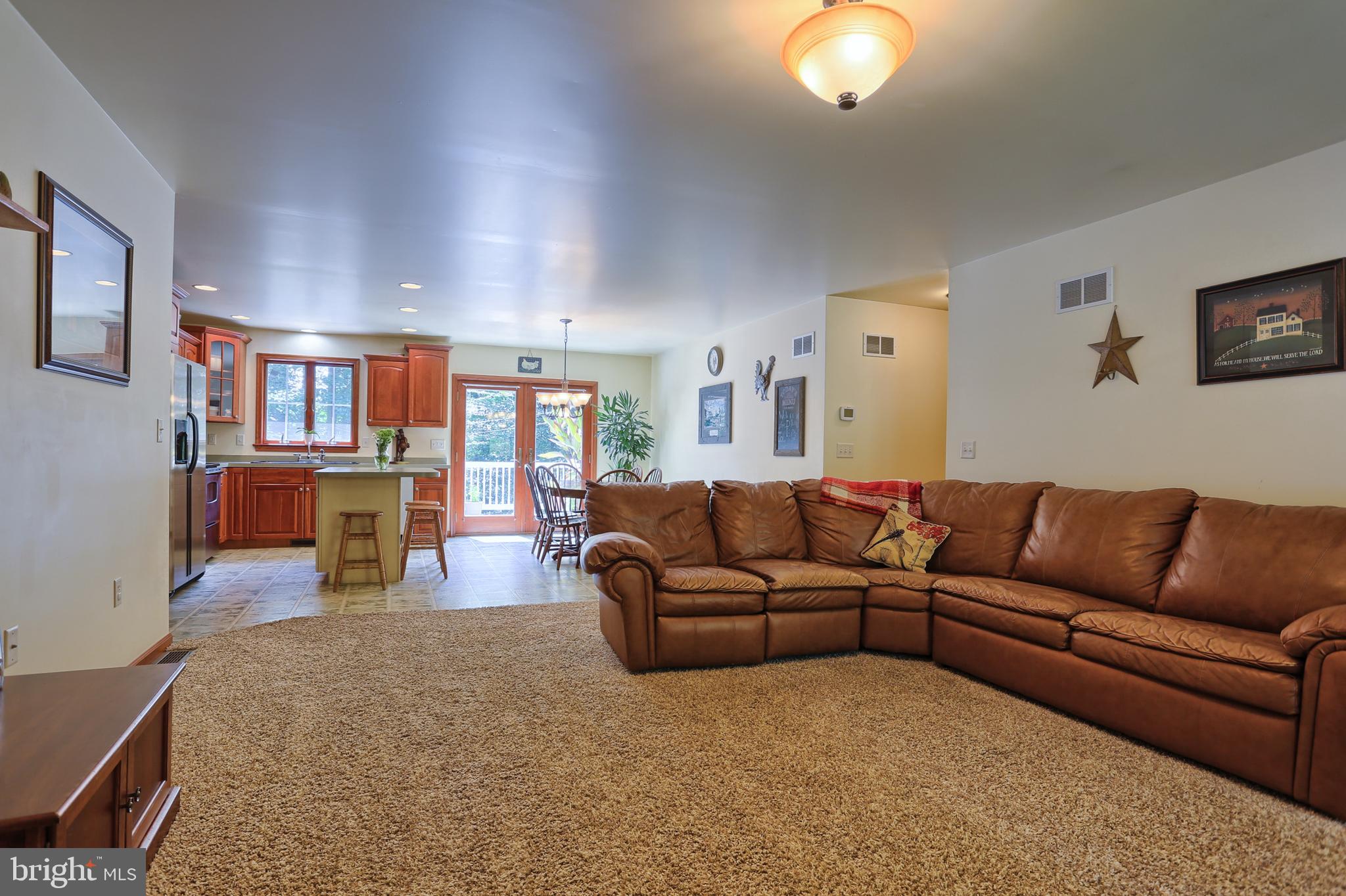 655 Forest Road Denver, PA 17517 - Photo 15 of 66 Spacious living room, open to kitchen/dining