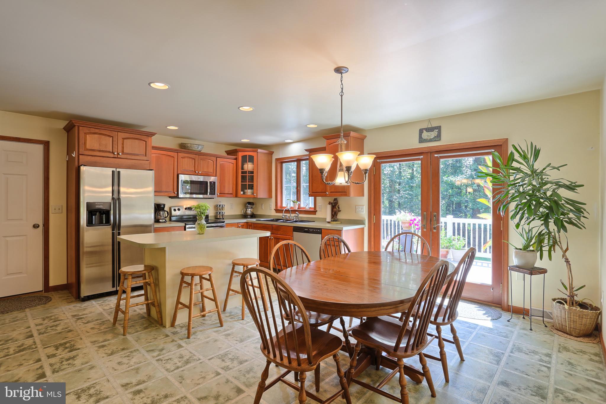 655 Forest Road Denver, PA 17517 - Photo 9 of 66 Kitchen/dining area opens to large deck