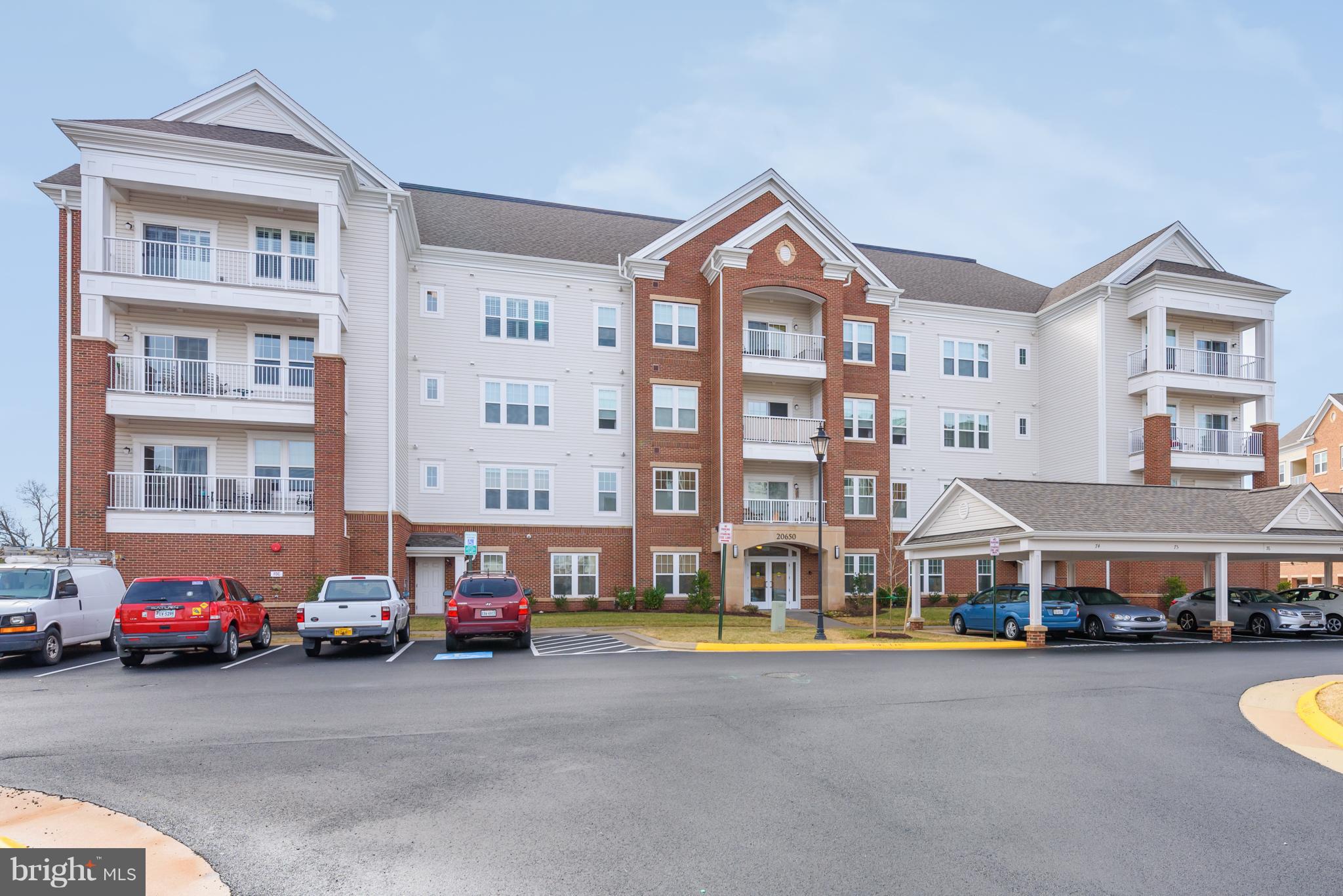 20650 Hope Spring Terrace, Unit 103 Ashburn, VA 20147 - Photo 1 of 30 a view of a street with cars