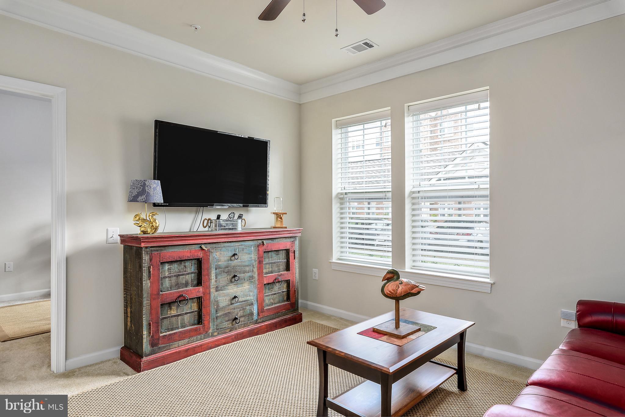 20650 Hope Spring Terrace, Unit 103 Ashburn, VA 20147 - Photo 12 of 30 a view of a livingroom with workspace and a window
