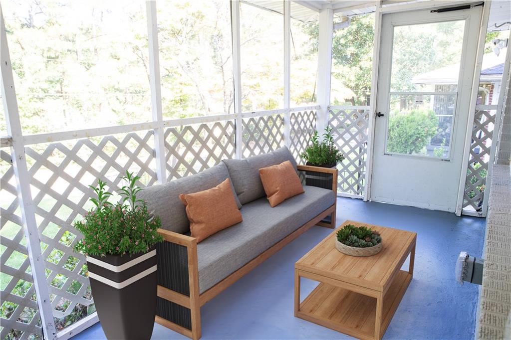 145 Holly Road Northwest Atlanta, GA 30314 - Photo 3 of 28 a living room with furniture and wooden floor