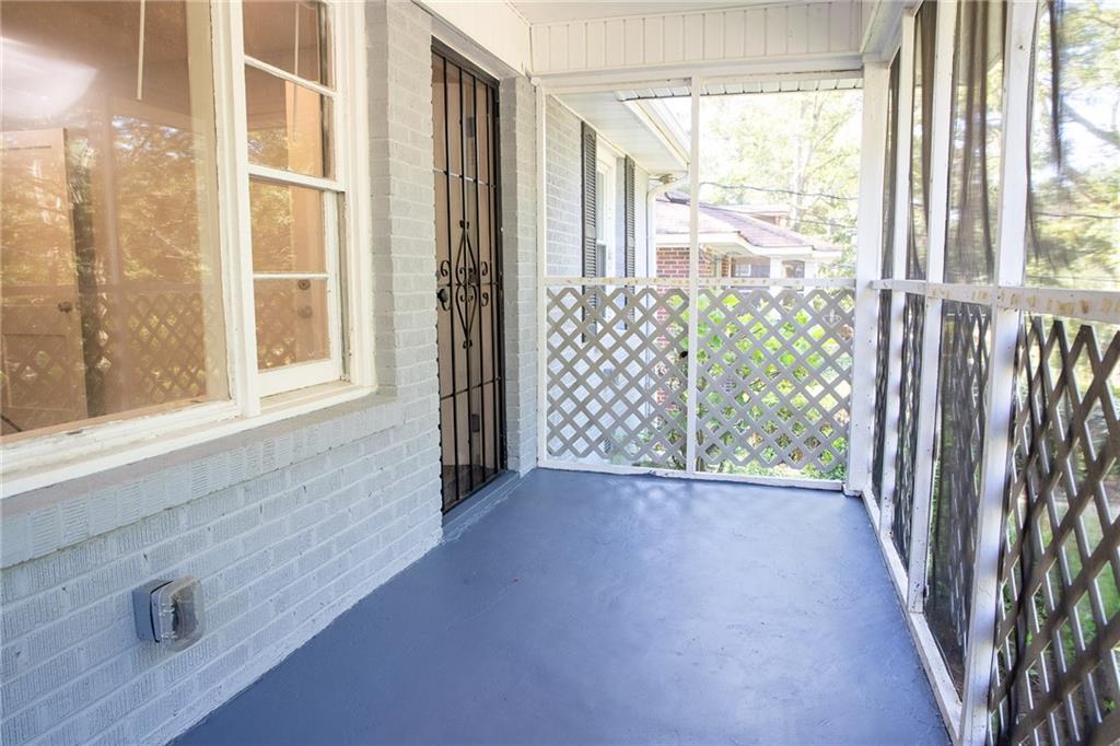145 Holly Road Northwest Atlanta, GA 30314 - Photo 7 of 28 a view of an empty room with a window
