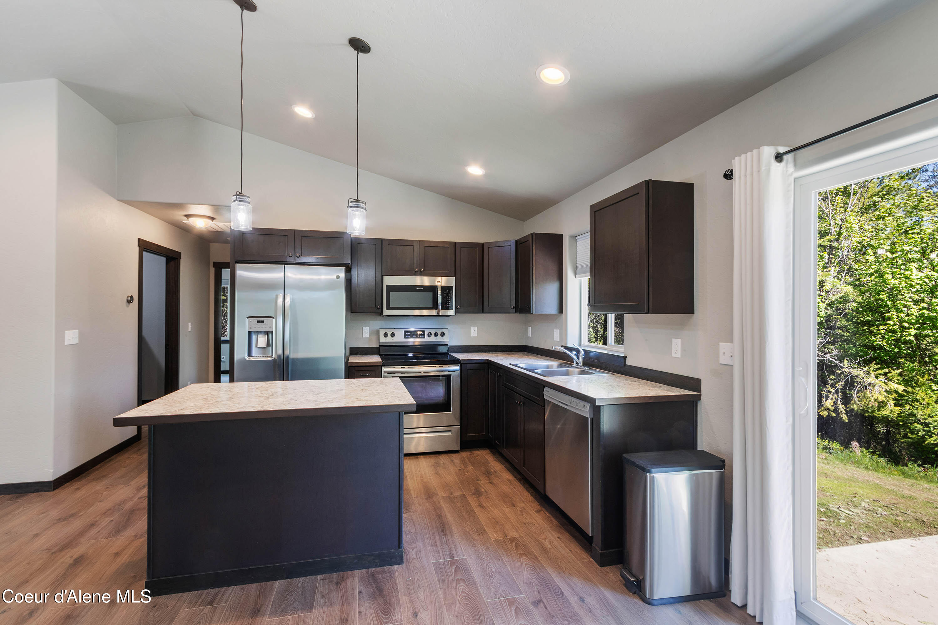 1279 Gypsy Bay Road Sagle, ID 83860 - Photo 9 of 37 Dining to Kitchen