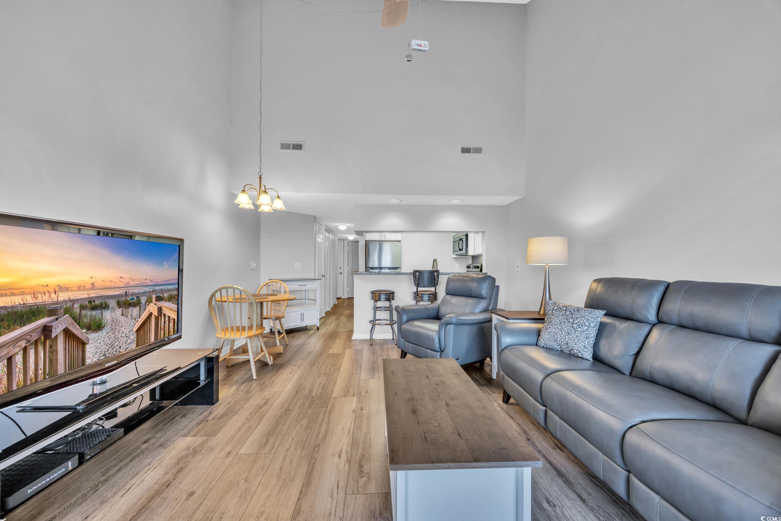 1100 Possum Trot Road, Unit C202 North Myrtle Beach, SC 29582 - Photo 17 of 34 Living room featuring light wood-style floors, a c