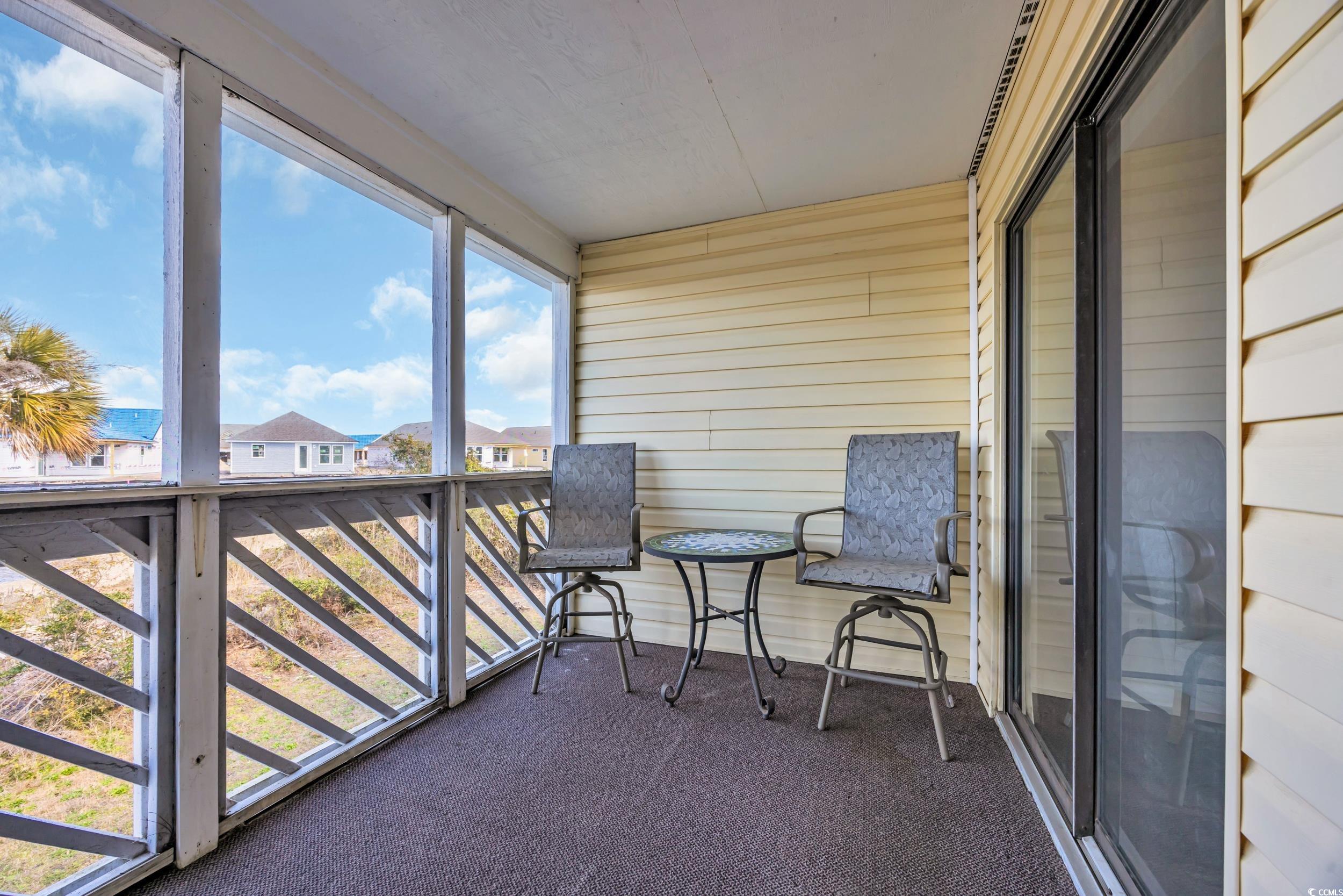 1100 Possum Trot Road, Unit C202 North Myrtle Beach, SC 29582 - Photo 18 of 34 Sunroom / solarium featuring plenty of natural lig